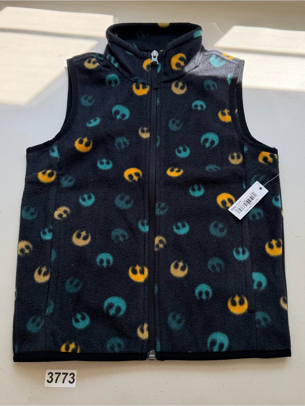 Sleeveless fleece vest featuring repeated Rebel Alliance emblems. Black base wit